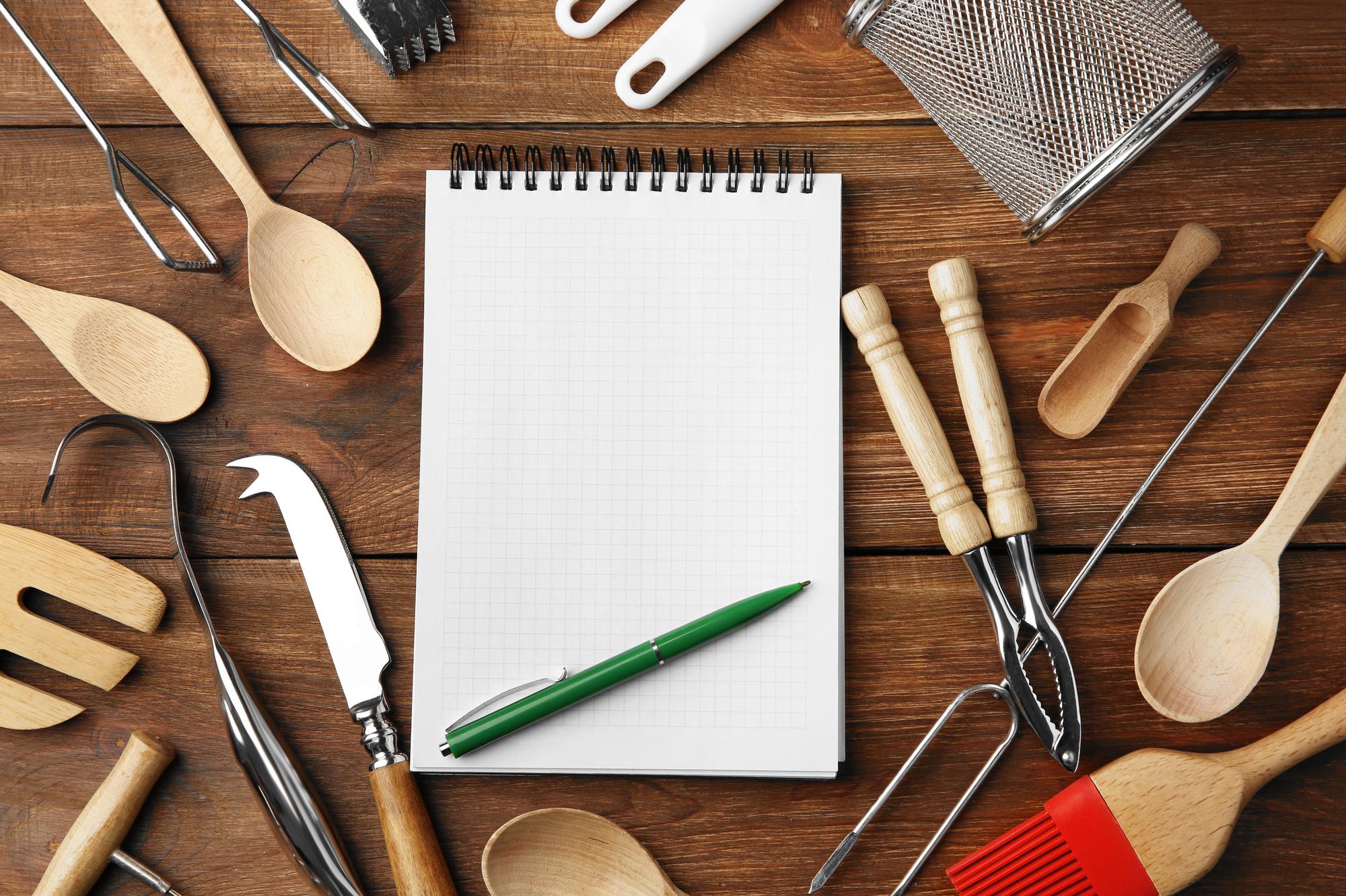flatlay of culinary tools and notes